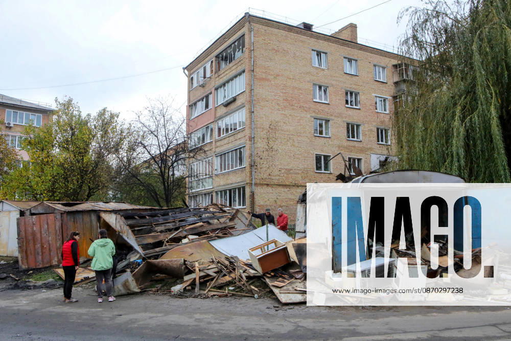 Residents stand near garages damaged by a Russian drone attack, Petropavlivska Borshchahivka, Kyiv region, Ukraine, October 21, 2026. (Photo by Volodymyr Tarasov Ukrinform) Consequences of Russian drone attack in Kyiv region
