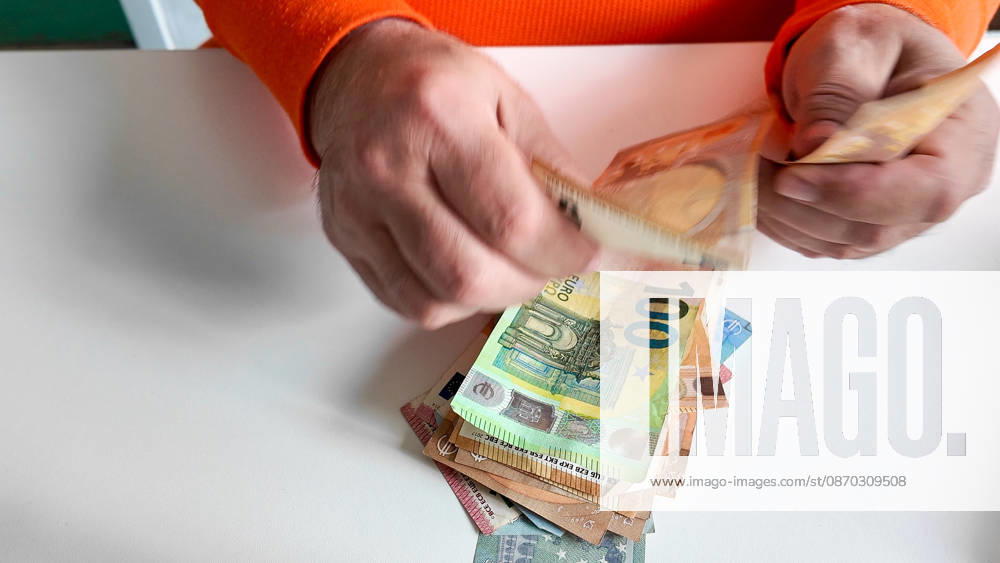 Counting money: banknotes, hands; euro banknotes are being counted October 21, 2026