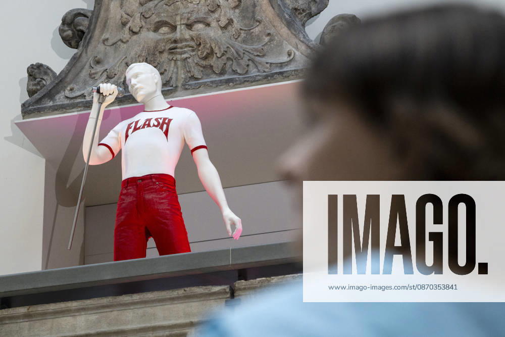 LONDON, UK. ‘Flash ensemble, 1980, and half-micâ€⠢, 1980s, T-shirt customised by Freddie Mercury, at a preview of ‘Freddie Mercury Splendid Thingsâ€⠢ at the V&A, South Kensington. To mark the 80th anniversary year of Freddie Mercuryâ€⠢s birth, eight looks worn by him are displayed around the museum in a trail ,developed with Mary Austin, his former fianco e and close friend, to celebrate his career through costumes and accessories worn in some of Queenâ€⠢s most memorable music videos and performances. The show runs to 17 January 2027. London UK - ZUMAl94_ 20261022_zaf_l94_002