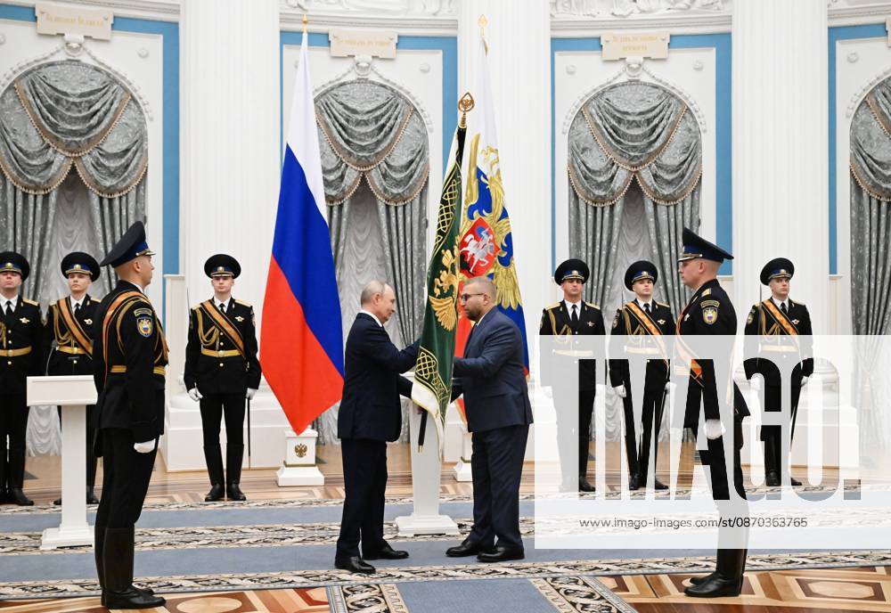 Russia Putin Federal Customs Service 9270428 22.10.2026 Russian President Vladimir Putin and Federal Customs Service head Valery Pikalev attend a ceremony to present the agency with its banner at the Kremlin in Moscow, Russia. Pelagiya Tikhonova Sputnik Moscow Russia