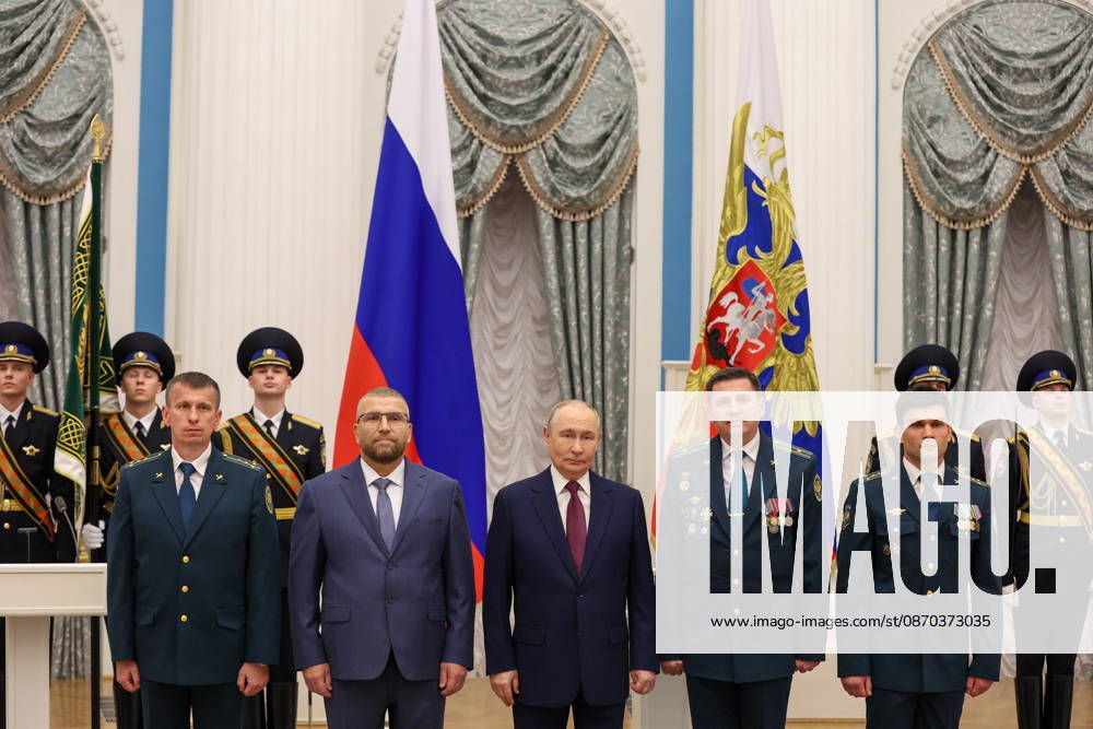 RUSSIA, MOSCOW - OCTOBER 22, 2026: Russia s President Vladimir Putin (C) and the Federal Customs Service of Russia to the agency s head Valery Pikalev (2nd L front) are seen during a ceremony at the Kremlin in which Pikalev was presented the agency s banner. Approved by a presidential decree in 2019, the banner has not yet been presented to the agency s top official Moscow Russia - ZUMAt113 20261022_zaa_t113_404