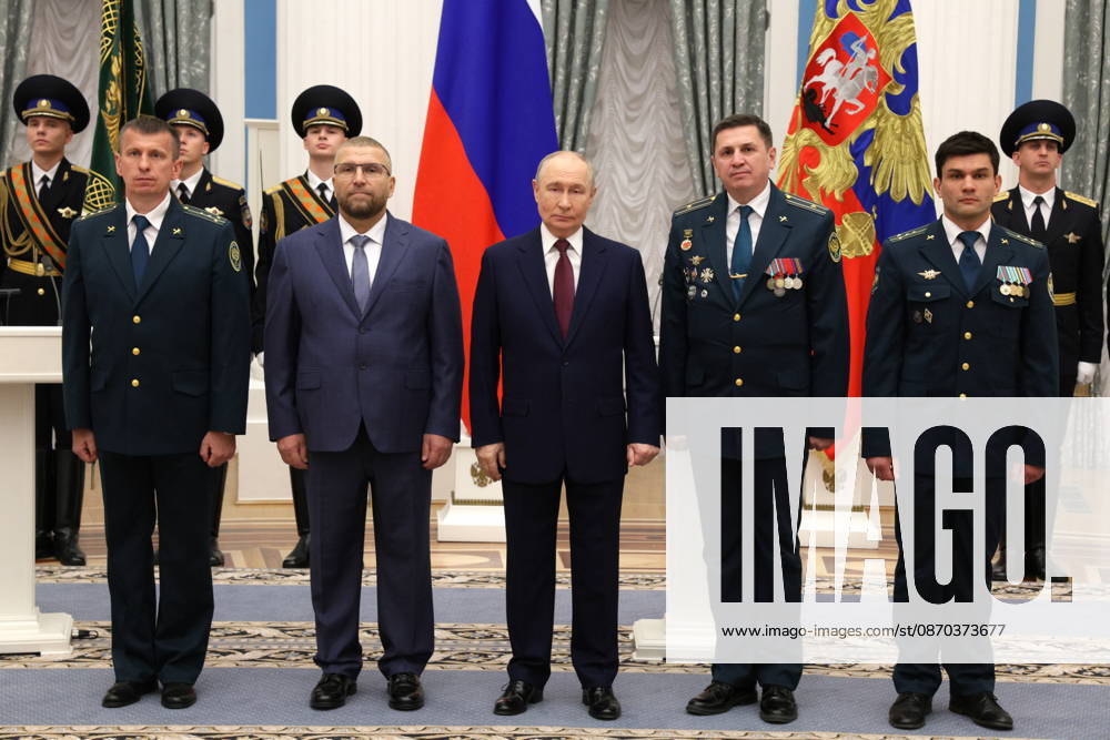 RUSSIA, MOSCOW - OCTOBER 22, 2026: Russia s President Vladimir Putin (C) and the Federal Customs Service of Russia to the agency s head Valery Pikalev (2nd L front) are seen during a ceremony at the Kremlin in which Pikalev was presented the agency s banner. Approved by a presidential decree in 2019, the banner has not yet been presented to the agency s top official Moscow Russia - ZUMAt113 20261022_zaa_t113_411