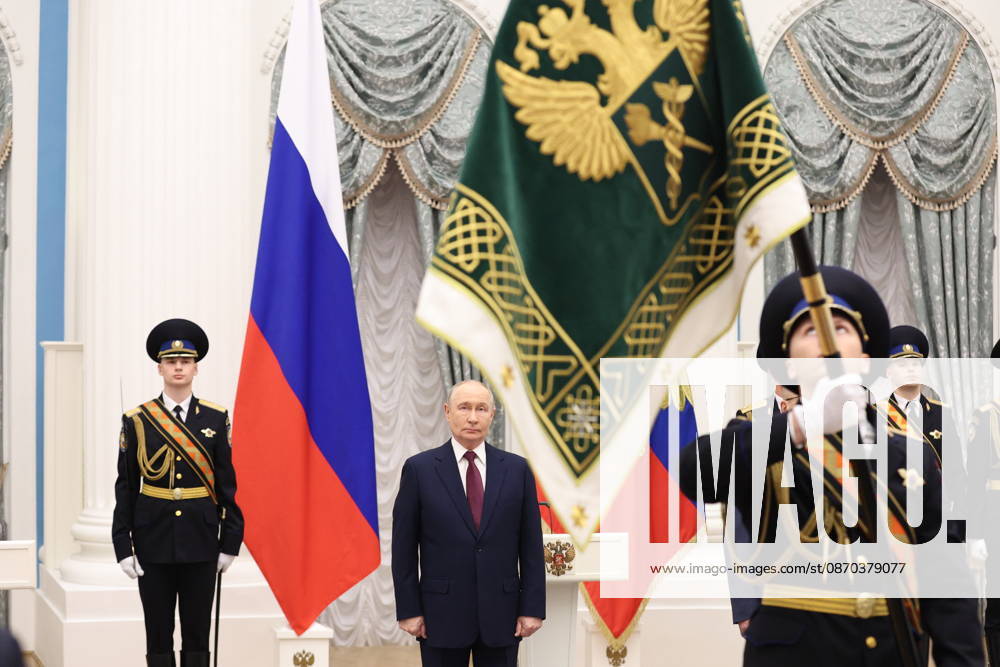RUSSIA, MOSCOW - OCTOBER 22, 2026: Russia s President Vladimir Putin (C) is seen during a ceremony to present the banner of the Federal Customs Service of Russia to the agency s head Pikalev. Approved by a presidential decree in 2019, the banner has not yet been presented to the agency s top official. Mikhail Sinitsyn TASS 99764452