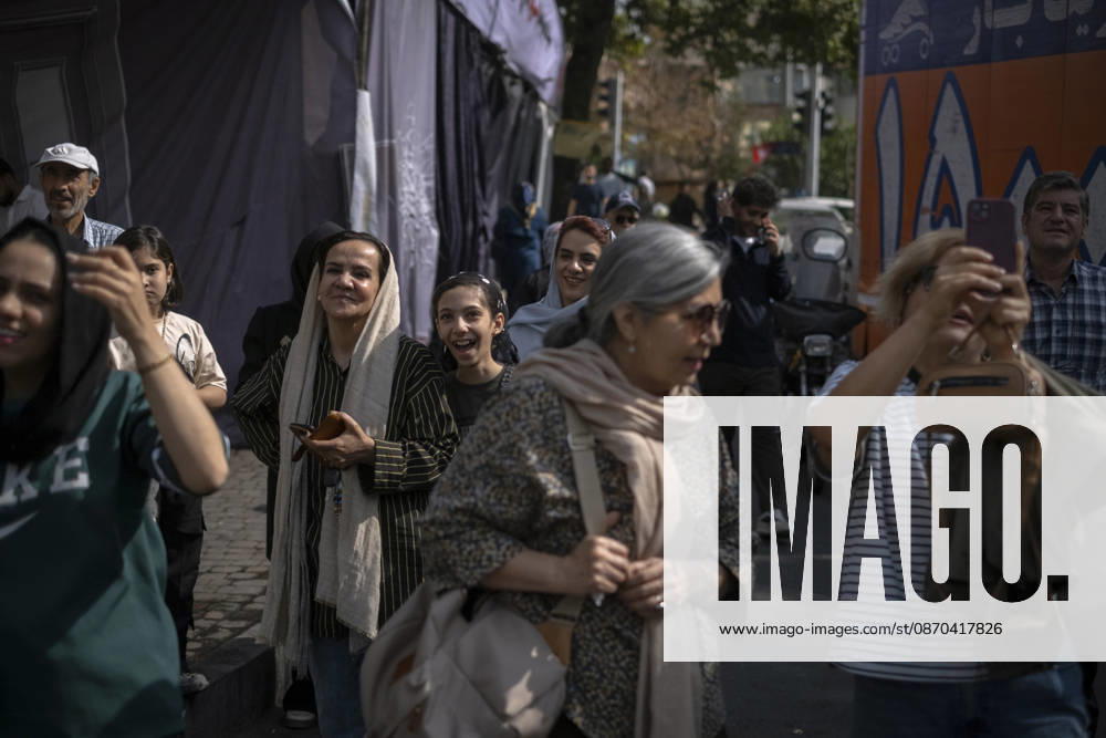 Anti-U.S. President Trump Performance On Billboard Reactions A young Iranian girl reacts as she looks at a masked man (not pictured) performing as U.S. President Donald Trump inside a symbolic cell mounted on a billboard in northern Tehran, Iran, on October 22, 2026, amid escalating tensions between Iran and the United States. Tehran Tehran Iran