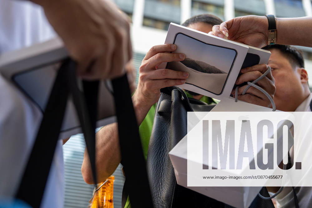 First Day on sale of IPhone Duo in Hong Kong iPhone resellers holding boxes of iPhone Duo outside an Apple Store on October 22, 2026 in Hong Kong. The iPhone DUO is Apple INC.s first foldable phone, today is the first day the new iPhone DUO is available to the public. (Photo by Vernon Yuen Nexpher Images) HONG KONG HONG KONG