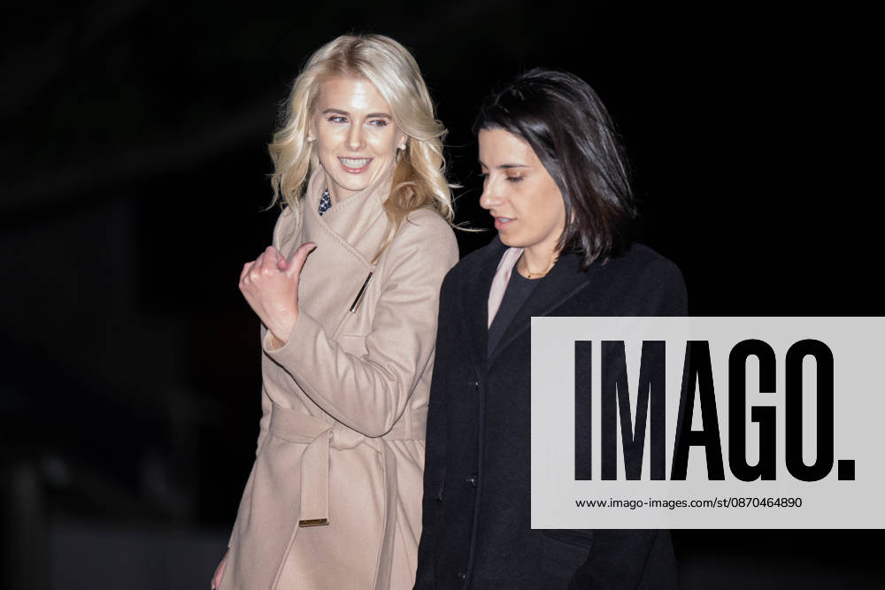 NATALIE HARP and DANIELLE ALVAREZ walk toward the White House following President DONALD TRUMPs return from a campaign rally in Sioux City, Iowa. Washington United States - ZUMAk206 20261023_znp_k206_007