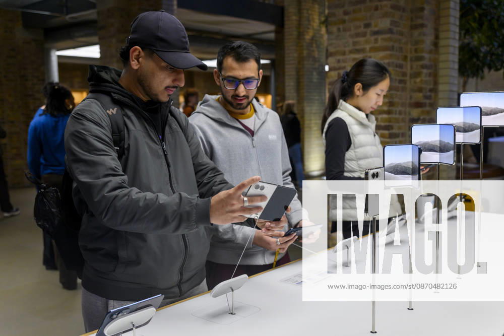 London, UK. Customers inside the Apple Covent Garden store view and buy the new Apple iPhone Duo, the companyÃ¢â‚¬â ¢s first foldable iPhone. Opened, it is the thinnest iPhone ever, with a 7.6-inch inner display that provides a large canvas for viewing content, gaming, and multitasking, and a special nano-texture finish that minimises glare for an unparalleled viewing experience. Closed, the 5.4-inch outer display delivers 90 percent of the screen area of iPhone 18 Pro in a compact, pocketable design. London UK - ZUMAl94_ 20261023_zaf_l94_018