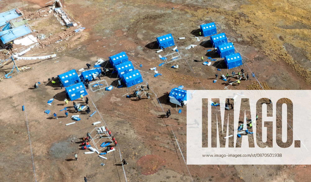 (261023) -- LHASA, Oct. 23, 2026 -- An aerial drone photo taken on Oct. 23, 2026 shows emergency tents at an earthquake-hit village in Maru Township of Baqen County, Nagqu City, southwest China s Xizang Autonomous Region. Sixteen people have been killed and 76 others are injured following a 7.0-magnitude earthquake which struck Baqen County of the city of Nagqu in southwest China s Xizang Autonomous Region at 10:33 p.m. on Thursday, local authorities said. The Ministry of Emergency Management and authorities in Xizang have mobilized resources for rescue and relief operations. ) (SpotNews) CHINA-XIZANG-NAGQU-EARTHQUAKE-RESCUE AND RELIEF (CN) TenzinxNyida