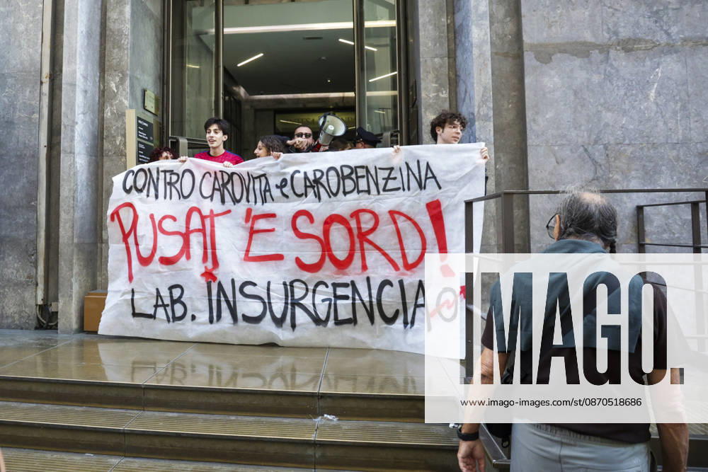 Activists Target Banks Over Cost-of-Living Crisis Activists from Insurgencia, together with the Argo and Kaos collectives, are organising a protest outside the Intesa Sanpaolo offices on Via Toledo in Naples. Some protesters are dressed as Spider-Man and are waving banners bearing the Neapolitan slogan ˜Pusate e sord!. The activists accuse the banks of continuing to make excessive profits whilst ordinary people face growing financial hardship, and criticise the Meloni government for its response to the recent disruptions to fuel and food supplies. Napoli October 23 2026, ABP17337