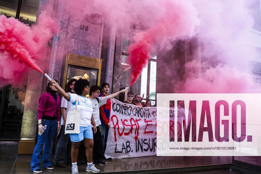 Activists Target Banks Over Cost-of-Living Crisis Activists from Insurgencia, together with the Argo and Kaos collectives, are organising a protest outside the Intesa Sanpaolo offices on Via Toledo in Naples. Some protesters are dressed as Spider-Man and are waving banners bearing the Neapolitan slogan ˜Pusate e sord!. The activists accuse the banks of continuing to make excessive profits whilst ordinary people face growing financial hardship, and criticise the Meloni government for its response to the recent disruptions to fuel and food supplies. Napoli October 23 2026, ABP17515