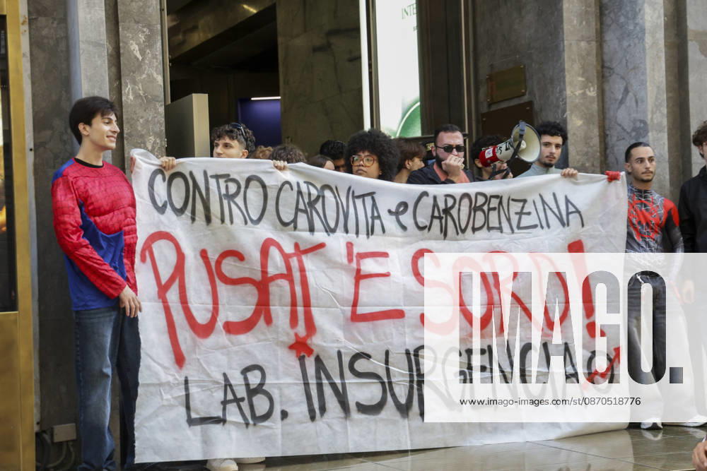 Activists Target Banks Over Cost-of-Living Crisis Activists from Insurgencia, together with the Argo and Kaos collectives, are organising a protest outside the Intesa Sanpaolo offices on Via Toledo in Naples. Some protesters are dressed as Spider-Man and are waving banners bearing the Neapolitan slogan ˜Pusate e sord!. The activists accuse the banks of continuing to make excessive profits whilst ordinary people face growing financial hardship, and criticise the Meloni government for its response to the recent disruptions to fuel and food supplies. Napoli October 23 2026, ABP17382