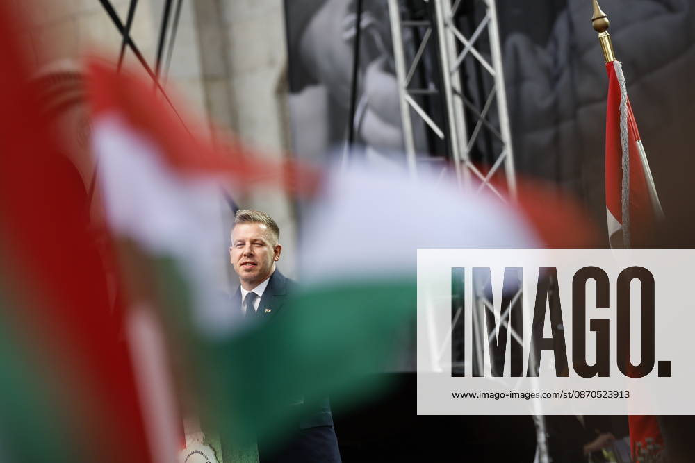 Hungary marks the 70th anniversary of failed 1956 counter-revolution BUDAPEST, HUNGARY - OCTOBER 23: People wave Hungarian flags as Hungarian Prime Minister Peter Magyar gives a speech in front of the Hungarian Parliament Building on October 23, 2026 in Budapest, Hungary. A national program of commemoration events are taking place to mark the 70th anniversary of Hungary s failed 1956 counter-revolution, during which an estimated 2,500 - 3,000 Hungarians were killed amid a Soviet crackdown. Foreign guests, including European Commission President Ursula von der Leyen, are attending a speech by Hungarian Prime Minister Peter Magyar to mark the anniversary of the uprising. Arpad Kurucz Anadolu Budapest Hungary. Editorial use only. Please get