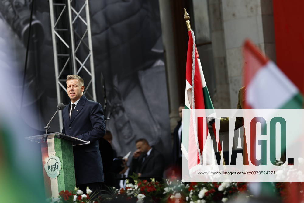 Hungary marks the 70th anniversary of failed 1956 counter-revolution BUDAPEST, HUNGARY - OCTOBER 23: People wave Hungarian flags as Hungarian Prime Minister Peter Magyar gives a speech in front of the Hungarian Parliament Building on October 23, 2026 in Budapest, Hungary. A national program of commemoration events are taking place to mark the 70th anniversary of Hungary s failed 1956 counter-revolution, during which an estimated 2,500 - 3,000 Hungarians were killed amid a Soviet crackdown. Foreign guests, including European Commission President Ursula von der Leyen, are attending a speech by Hungarian Prime Minister Peter Magyar to mark the anniversary of the uprising. Arpad Kurucz Anadolu Budapest Hungary. Editorial use only. Please get