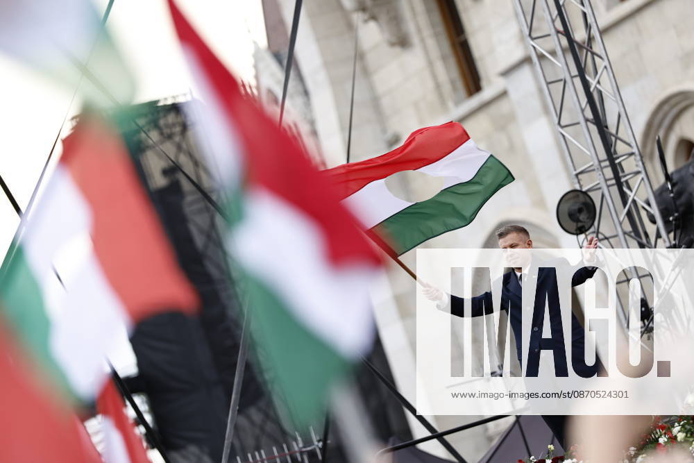 Hungary marks the 70th anniversary of failed 1956 counter-revolution BUDAPEST, HUNGARY - OCTOBER 23: People wave Hungarian flags as Hungarian Prime Minister Peter Magyar gives a speech in front of the Hungarian Parliament Building on October 23, 2026 in Budapest, Hungary. A national program of commemoration events are taking place to mark the 70th anniversary of Hungary s failed 1956 counter-revolution, during which an estimated 2,500 - 3,000 Hungarians were killed amid a Soviet crackdown. Foreign guests, including European Commission President Ursula von der Leyen, are attending a speech by Hungarian Prime Minister Peter Magyar to mark the anniversary of the uprising. Arpad Kurucz Anadolu Budapest Hungary. Editorial use only. Please get