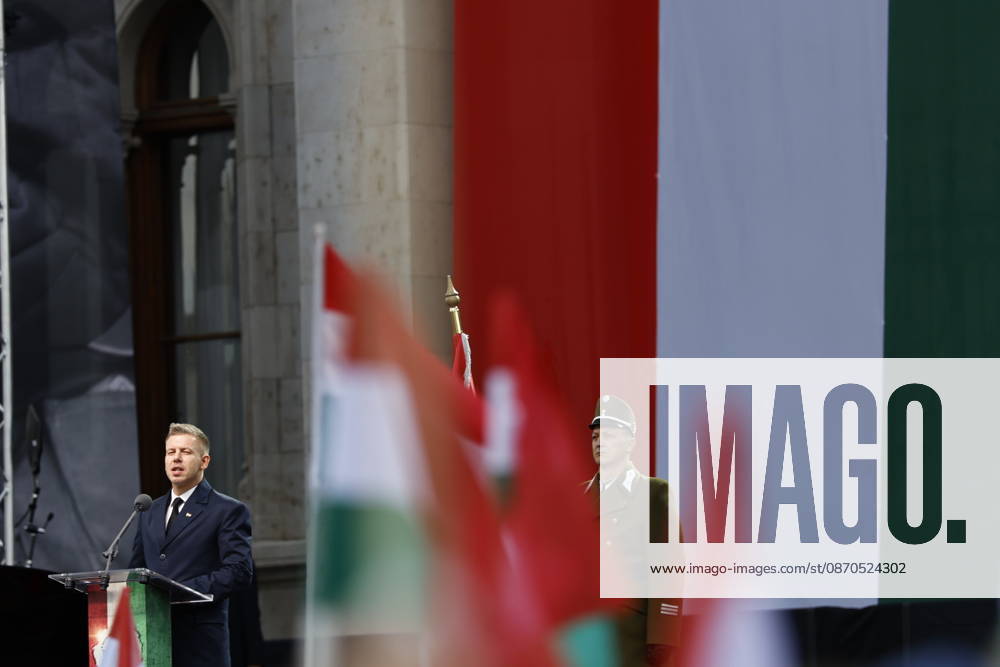 Hungary marks the 70th anniversary of failed 1956 counter-revolution BUDAPEST, HUNGARY - OCTOBER 23: People wave Hungarian flags as Hungarian Prime Minister Peter Magyar gives a speech in front of the Hungarian Parliament Building on October 23, 2026 in Budapest, Hungary. A national program of commemoration events are taking place to mark the 70th anniversary of Hungary s failed 1956 counter-revolution, during which an estimated 2,500 - 3,000 Hungarians were killed amid a Soviet crackdown. Foreign guests, including European Commission President Ursula von der Leyen, are attending a speech by Hungarian Prime Minister Peter Magyar to mark the anniversary of the uprising. Arpad Kurucz Anadolu Budapest Hungary. Editorial use only. Please get