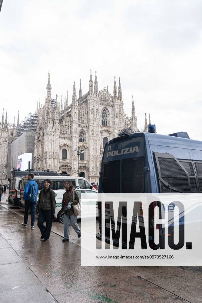 IPA90074205 - Milan, 10 26 23. The city center is preparing for tomorrows heavily secured Saturday ahead of the march. From police and Carabinieri checkpoints at the Duomo to storefronts reinforced with panels to prevent break-ins on Via Torino.