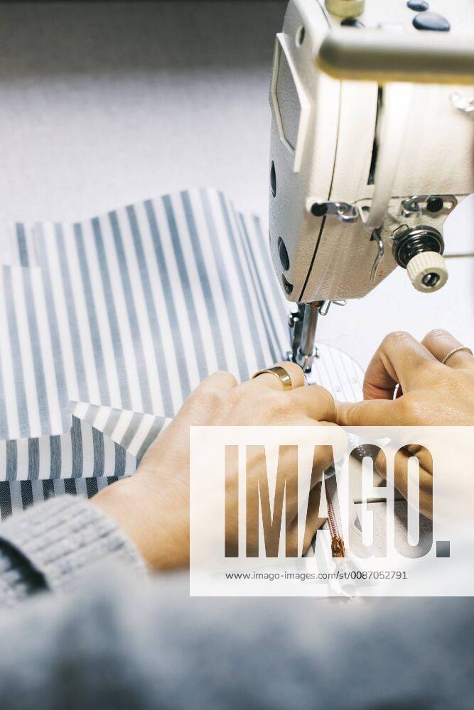 Close-up of woman using sewing machine model released Symbolfoto property released JUBF00284