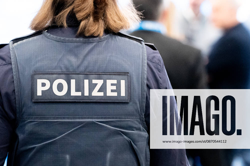 The 2026 convention of the CSU (Christian Social Union) at the Munich Trade Fair Center. Background detail: A female police officer in uniform