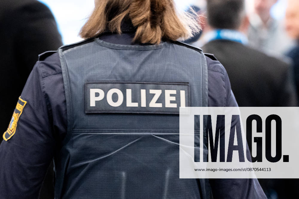 The 2026 convention of the CSU (Christian Social Union) at the Munich Trade Fair Center. Background detail: A female police officer in uniform