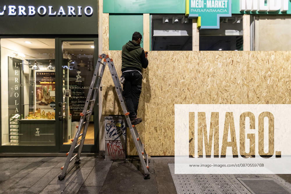 Shops in Milan board up windows ahead of cost-of-living protest MILAN, ITALY – OCTOBER 23: On the eve of an unauthorized demonstration against the high cost of living, some shop windows are being covered with wooden panels for protection in Milan, Italy, on October 23, 2026. This measure follows the destruction and looting that took place in Milan the previous weekend during similar protests against the high cost of living. Andrea Carrubba Anadolu Milan Italy. Editorial use only. Please get in touch for any other usage.