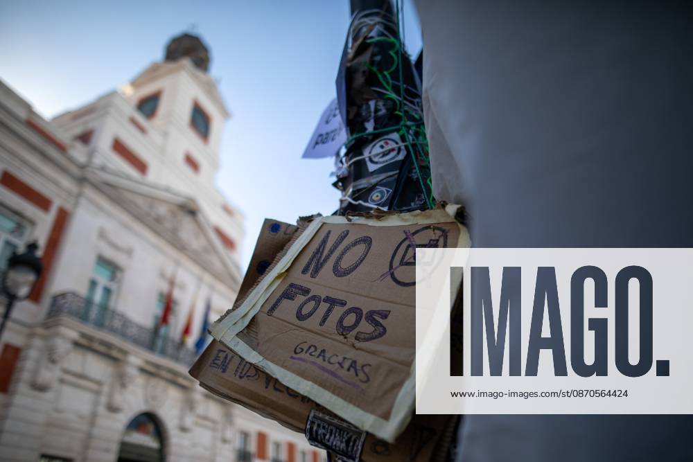 A sign prohibiting photography can be seen at Puerta del Sol..Tents remain set up by housing rights activists, who organized the occupation of the square in response to the eviction of Maricarmen a woman in her eighties from her home, carried out by a real estate investment fund. Madrid Spain - ZUMAs197 20261023_aaa_s197_148