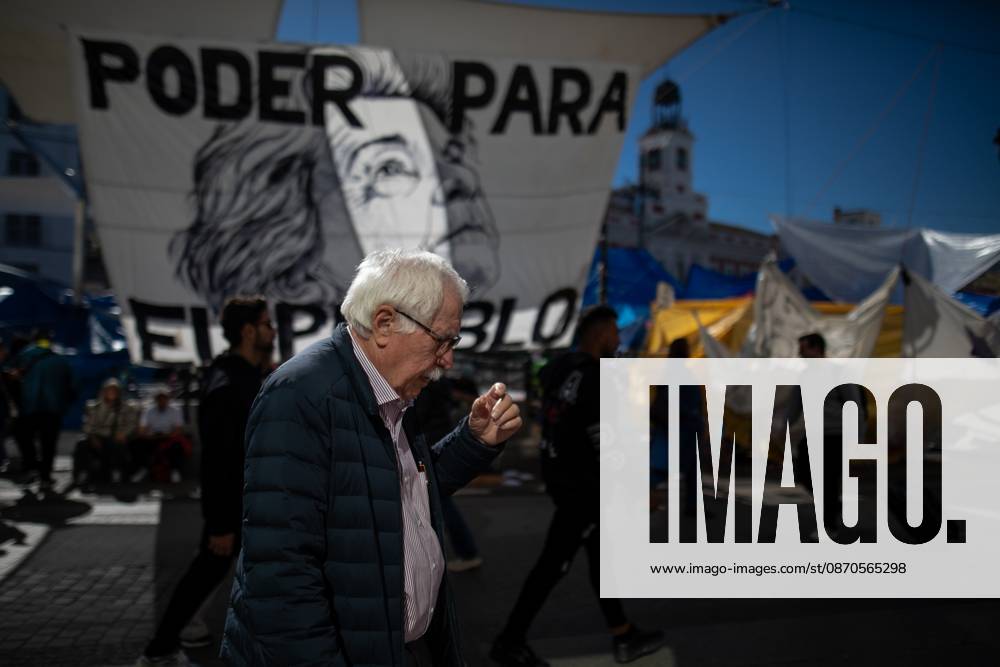 A man walks in front of tents set up at Puerta del Sol..Tents remain set up by housing rights activists, who organized the occupation of the square in response to the eviction of MaricarmenÃ¢â‚¬a woman in her eightiesÃ¢â‚¬from her home, carried out by a real estate investment fund. Madrid Spain - ZUMAs197 20261023_aaa_s197_147