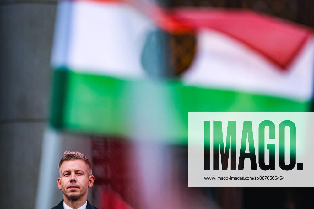 PETER MAGYAR, Hungarian Prime Minister, Hungary, Budapest, 1956 Hungarian Revolution, 70th Anniversary, October 23, Revolutionary Flag, Hungarian Flag, Waving Flag, Political Portrait, Blurred Foreground, Hungarian Parliament, Kossuth Square, Commemoration Budapest Hungary - ZUMAo116 20261023_znp_o116_063