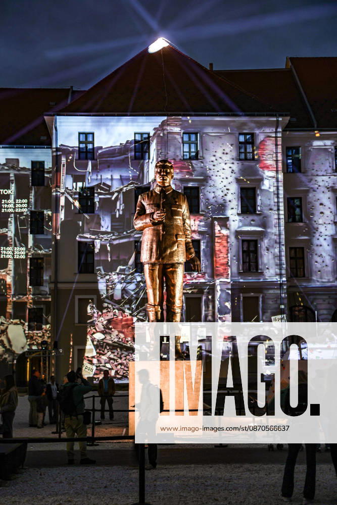 A statue of Soviet leader JOSEPH STALIN stands illuminated against a projection depicting a bullet-scarred building during a historical reenactment marking the 70th anniversary of the 1956 Hungarian Revolution. Protesters toppled Stalinâ€⠢s statue in Budapest on Oct. 23, 1956, in one of the defining acts of the uprising against Soviet-backed communist rule. Budapest Hungary - ZUMAo116 20261023_znp_o116_088