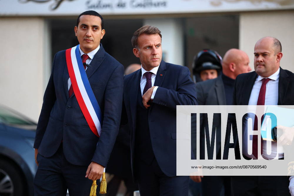 French President Macron in Trappes After Deadly Shooting - France French President Emmanuel Macron walks with Mayor of Trappes Ali Rabeh as he arrives for a meeting at the town hall after a drive-by shooting during which a person was killed and at least four others were wounded including a 12-year-old girl, in Trappes, in the Yvelines department, near Paris, France, October 23, 2026. Photo by Hannah McKay Pool ABACAPRESS.COM Trappes France