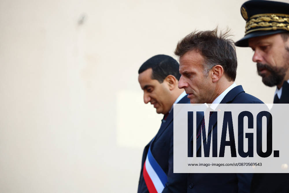 French President Macron in Trappes After Deadly Shooting - France French President Emmanuel Macron walks with Mayor of Trappes Ali Rabeh as he arrives for a meeting at the town hall after a drive-by shooting during which a person was killed and at least four others were wounded including a 12-year-old girl, in Trappes, in the Yvelines department, near Paris, France, October 23, 2026. Photo by Hannah McKay Pool ABACAPRESS.COM Trappes France