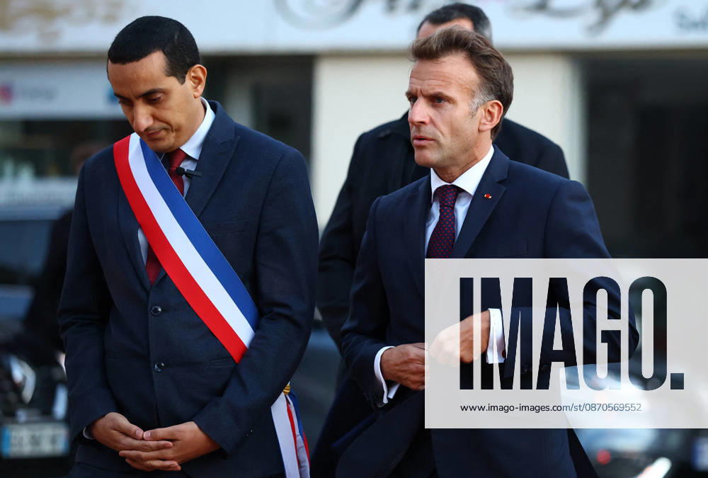 French President Macron in Trappes After Deadly Shooting - France French President Emmanuel Macron walks with Mayor of Trappes Ali Rabeh as he arrives for a meeting at the town hall after a drive-by shooting during which a person was killed and at least four others were wounded including a 12-year-old girl, in Trappes, in the Yvelines department, near Paris, France, October 23, 2026. Photo by Hannah McKay Pool ABACAPRESS.COM Trappes France
