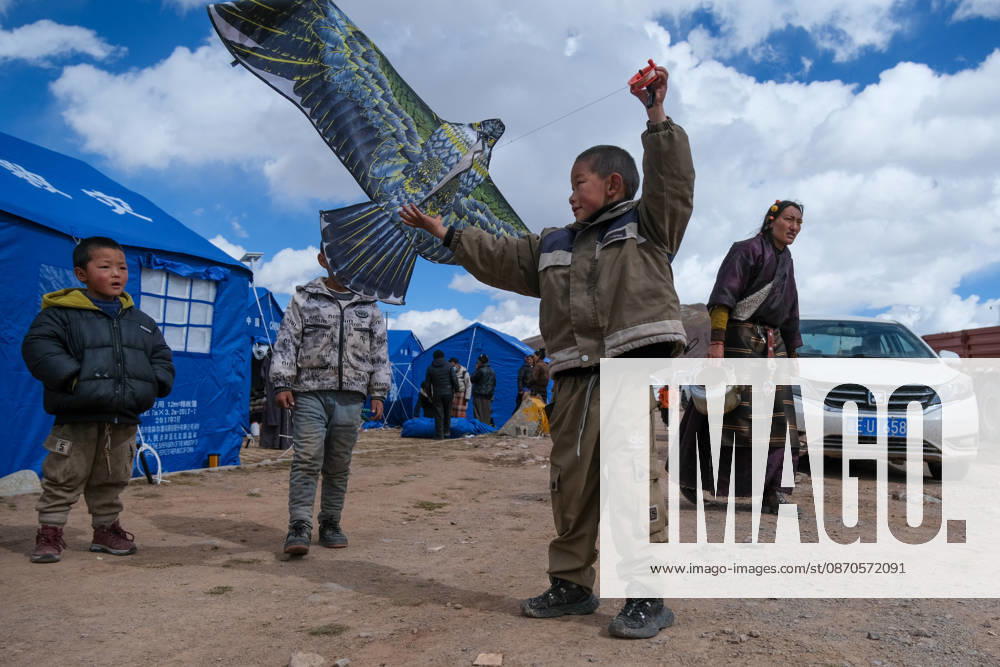 Children play with kites at a relocation site in Gangqie Township, Baqing County on October 24, 2026 in Nagqu, Xizang Autonomous Region of China. A 7.0-magnitude earthquake struck Baqing County on October 22, killing 16 people and injuring 76, according to local authorities.