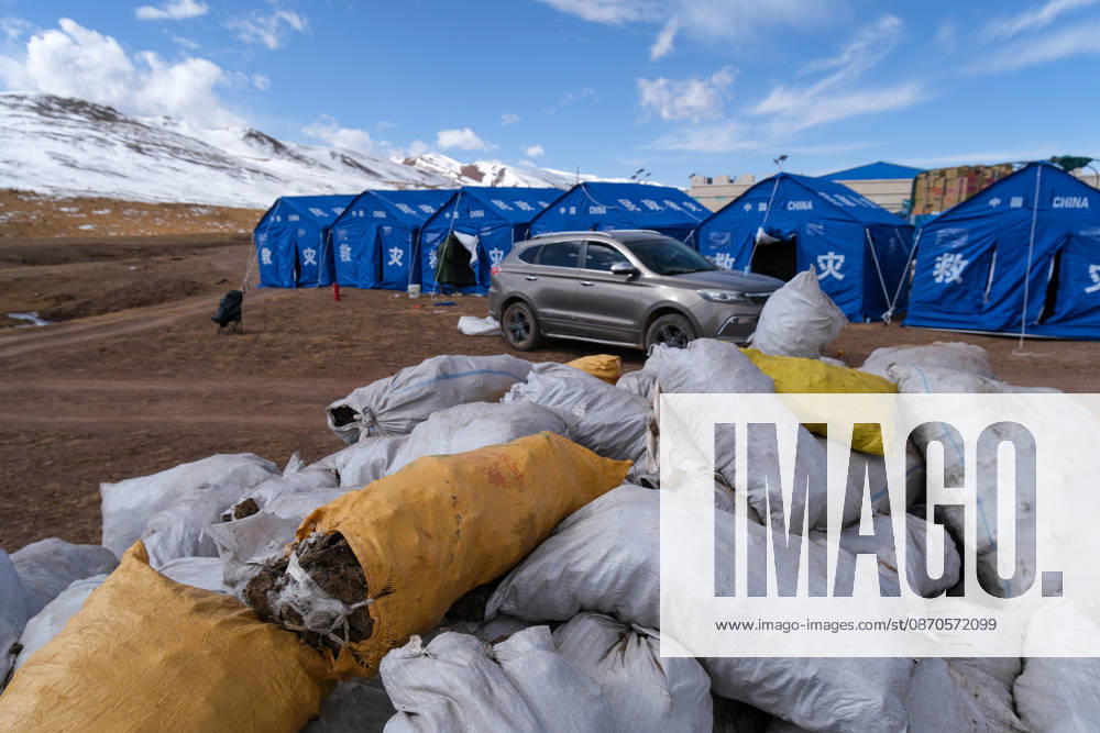 Dried yak dung, a primary winter fuel for local farmers and herders, is stacked at a relief settlement in Maru Township, Baqing County on October 24, 2026 in Nagqu, Xizang Autonomous Region of China. A 7.0 magnitude earthquake struck Baqing County on October 22, killing 16 people and injuring 76, while damaging or collapsing homes for 339 households and displacing nearly 12,500 residents.