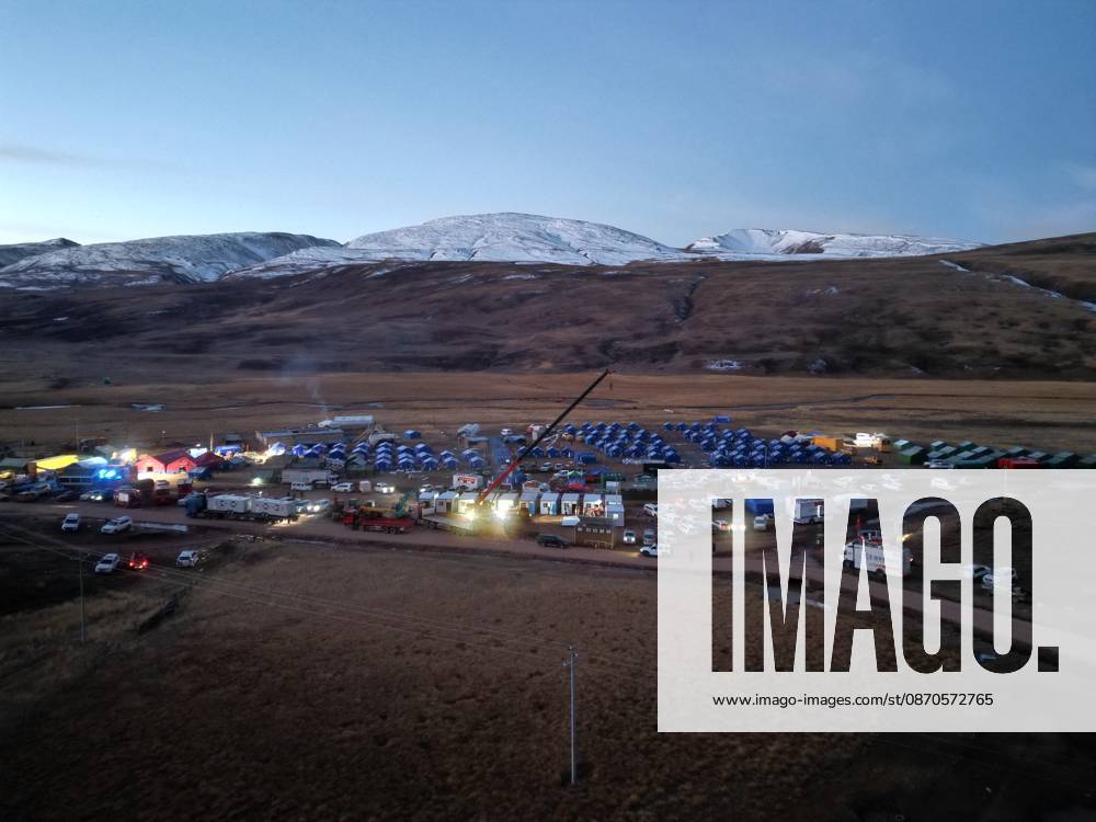 (261024) -- NAGQU, Oct. 24, 2026 -- An aerial drone photo taken on Oct. 24, 2026 shows workers of China Railway Group Limited building prefabricated houses at a quake-hit village in Maru Township of Baqen County, Nagqu City, southwest China s Xizang Autonomous Region. The first batch of prefabricated houses has been set up on Saturday for the affected residents in a village of Maru Township, one of the hardest-hit areas near the epicenter, following a 7.0-magnitude earthquake that struck Baqen County of the city of Nagqu in southwest China s Xizang Autonomous Region at 10:33 p.m. on Thursday. (Photo by Xinhua) (SpotNews) CHINA-XIZANG-NAGQU-EARTHQUAKE-RESETTLEMENT (CN) ChenxXiaojun