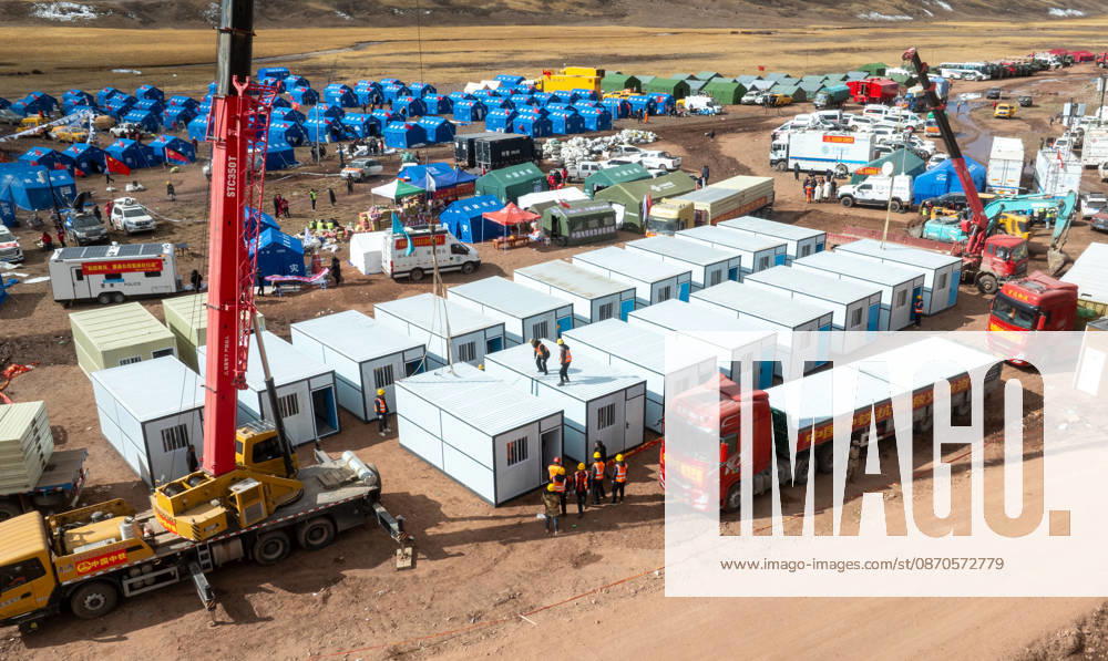 (261024) -- NAGQU, Oct. 24, 2026 -- A drone photo taken on Oct. 24, 2026 shows workers of China Railway Group Limited building prefabricated houses at a quake-hit village in Maru Township of Baqen County, Nagqu City, southwest China s Xizang Autonomous Region. The first batch of prefabricated houses has been set up on Saturday for the affected residents in a village of Maru Township, one of the hardest-hit areas near the epicenter, following a 7.0-magnitude earthquake that struck Baqen County of the city of Nagqu in southwest China s Xizang Autonomous Region at 10:33 p.m. on Thursday. ) (SpotNews) CHINA-XIZANG-NAGQU-EARTHQUAKE-RESETTLEMENT (CN) TenzinxNyida