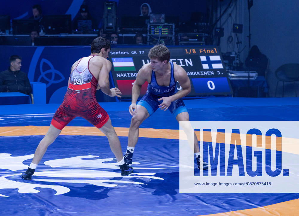 Astana, 2021 World Wrestling Championshi, Kazakhstan: Uzbekistan s Doniyorkhon Nakibov (red) competes against Finland s Jonni Kunnari Sarkkinen (blue) in the men s Greco-Roman 77kg competition at the Senior World Wrestling Championships in Astana, Kazakhstan, on October 24, 2026. Nakibov won the bout 7-2. . Astana Kazakhstan - ZUMAt172 20261024_zip_t172_001