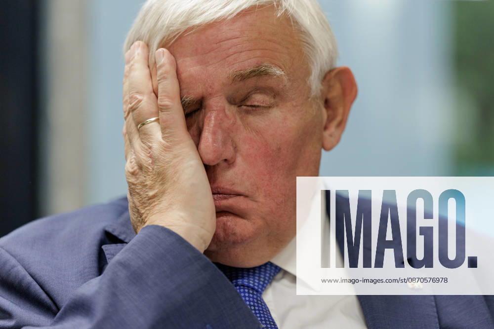 Karl Josef Laumann (CDU), Minister of Labor and Social Affairs for North Rhine-Westphalia, attended a WVS business breakfast on October 23, 2026, at the Caritas Emstor Workshops (WfbM) in Rheine, North Rhine-Westphalia, Germany, runs his hand across his face.