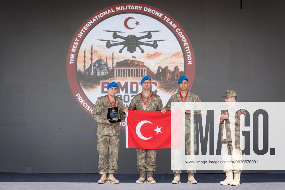 Best International Military Drone Team Competition in Ankara ANKARA, TURKIYE - OCTOBER 24: Chief of the General Staff Selcuk Bayraktaroglu (R) presents awards as Turkish Land Forces team wins the first place in the Best International Military Drone Team Competition (BIMDTC-2026), organized by the Turkish Land Forces Command, at Martyr Army Pilot First Lieutenant Gurcan Ulucan Square in Sincan Temelli, in Ankara, Turkiye on October 24, 2026. Ahmet Serdar Eser Anadolu Ankara Turkey. Editorial use only. Please get in touch for any other usage.