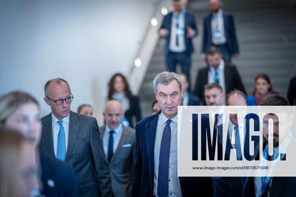 Chancellor Friedrich Merz speaks here alongside CSU Party Chairman Markus Söder on their way to Exhibition Hall C6 at the CSU Party Convention in Munich, Munich, Bavaria, Germany, Munich Exhibition Center