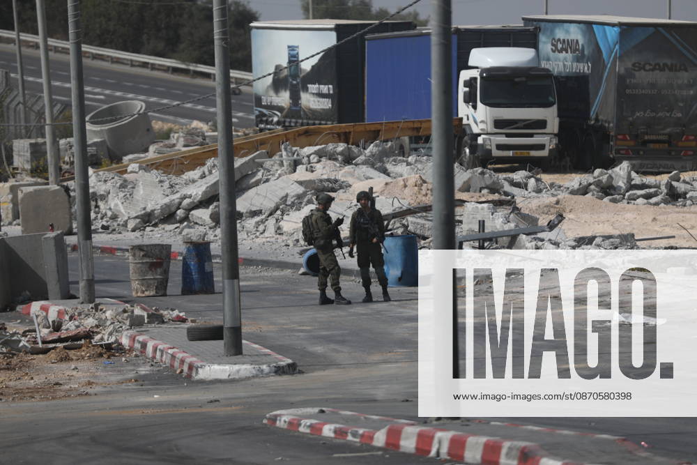 Israeli Soldiers and Military Vehicles Deployed Near Checkpoint in Hebron Israeli soldiers and military vehicles are deployed near a checkpoint where a shooting attack took place in the West Bank city of Hebron, on October 24, 2026. The deployment comes amid continuing Israeli military operations and heightened security measures in the area. Photo by Mamoun Wazwaz apaimages Hebron West Bank Palestinian Territory 241026_Hebron_MW_04(22)