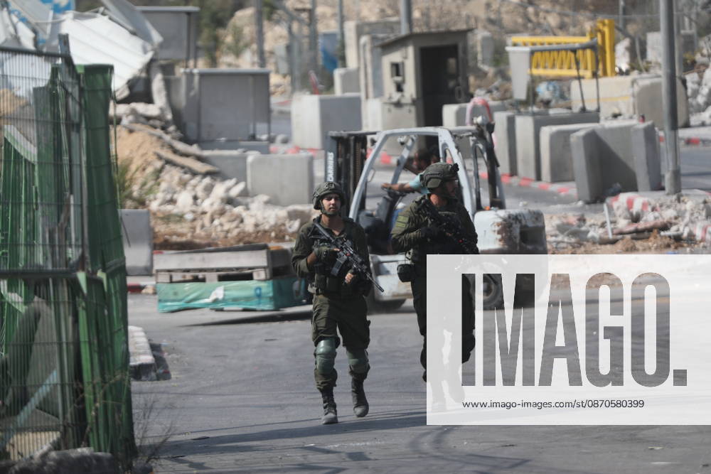 Israeli Soldiers and Military Vehicles Deployed Near Checkpoint in Hebron Israeli soldiers and military vehicles are deployed near a checkpoint where a shooting attack took place in the West Bank city of Hebron, on October 24, 2026. The deployment comes amid continuing Israeli military operations and heightened security measures in the area. Photo by Mamoun Wazwaz apaimages Hebron West Bank Palestinian Territory 241026_Hebron_MW_04(24)