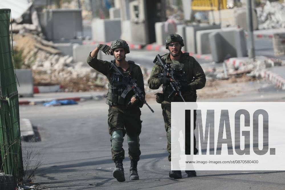 Israeli Soldiers and Military Vehicles Deployed Near Checkpoint in Hebron Israeli soldiers and military vehicles are deployed near a checkpoint where a shooting attack took place in the West Bank city of Hebron, on October 24, 2026. The deployment comes amid continuing Israeli military operations and heightened security measures in the area. Photo by Mamoun Wazwaz apaimages Hebron West Bank Palestinian Territory 241026_Hebron_MW_04(25)