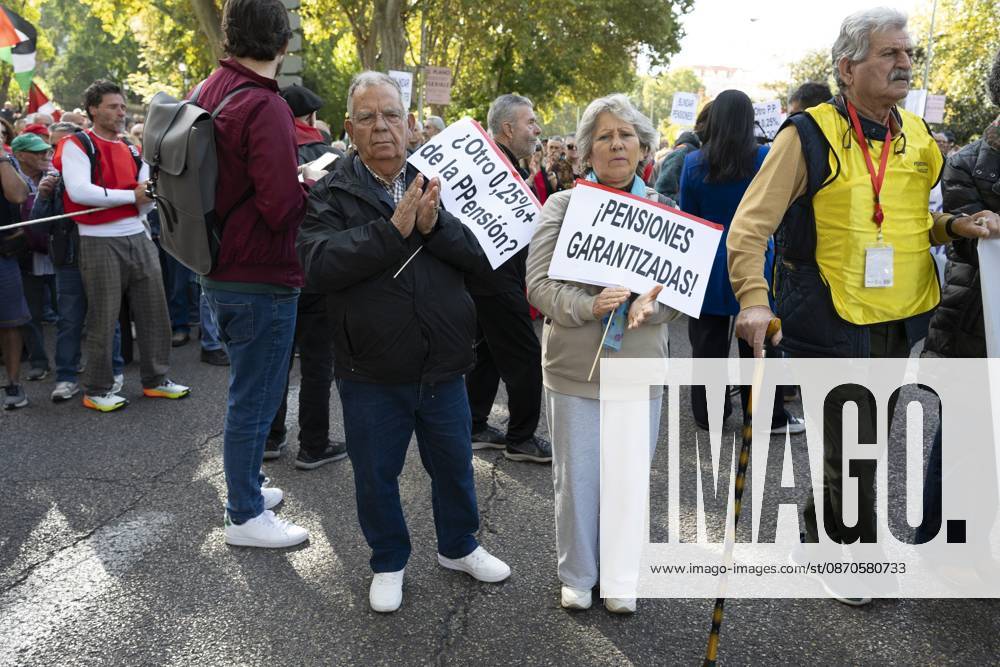 Several people carrying signs in favor of public pensions take part in a demonstration supporting the public pension system and access to housing in Madrid, Spain. Madrid Spain - ZUMAs197 20261024_aaa_s197_053