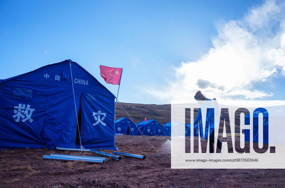 (261024) -- NAGQU, Oct. 24, 2026 -- A staff member sanitizes the tents area at a quake-hit village in Maru Township of Baqen County, Nagqu City, southwest China s Xizang Autonomous Region, Oct. 24, 2026. As of 11 a.m. Saturday, 52,450 items or sets of disaster relief supplies had been sent to the quake zone, while more than 2,500 rescue personnel were engaged in relief operations. Authorities have established 35 temporary resettlement sites in the disaster zone. Medical treatment and public health and epidemic prevention efforts are proceeding in an orderly manner, according to the local emergency command headquarters. ) (SpotNews) CHINA-XIZANG-NAGQU-EARTHQUAKE-RELIEF WORK (CN) TenzinxNyida