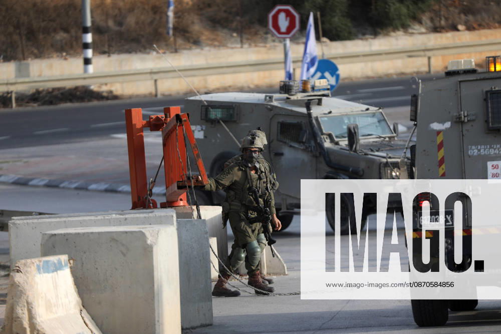(261024) -- HEBRON, Oct. 24, 2026 -- Israeli military forces are seen at an Israeli military checkpoint near the northern entrance to Hebron City, in the West Bank, on Oct. 24, 2026. Israeli forces launched a military operation in the West Bank city of Hebron on Friday night, hours after Israeli leaders vowed to displace residents and carry out demolitions following a shooting attack near the city that killed two Israeli soldiers. Prime Minister Benjamin Netanyahu also vowed to expand military operations and demolitions in Hebron, four days before Israel s parliamentary election. (Photo by Xinhua) MIDEAST-HEBRON-MILITARY-OPERATION MamounxWazwaz