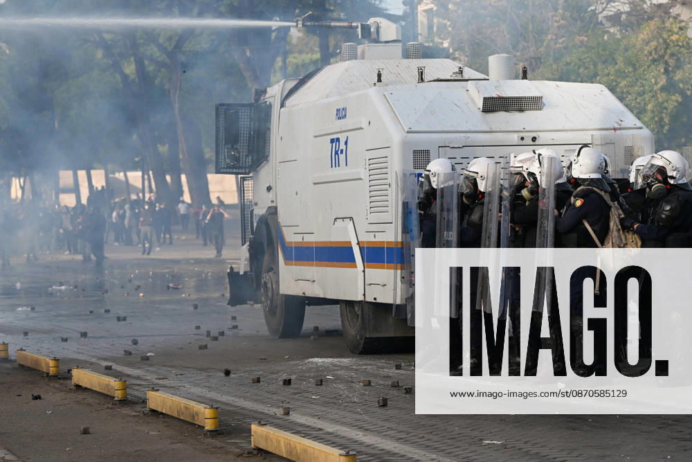 Mass Anti-Government National Protest in Tirana TIRANA, ALBANIA - OCTOBER 24: Riot police officers form a dense shield wall next to an active water cannon vehicle operating on a debris-strewn street on October 24, 2026, in Tirana, Albania. Unrest and physical confrontations erupt in Tirana city center as demonstrators and riot police clash during a massive nationwide protest, turning the capital s main avenue into a major flashpoint as chaotic skirmishes broke out between security forces and factions of the crowd. Artur Widak Anadolu Tirana Albania. Editorial use only. Please get in touch for any other usage.