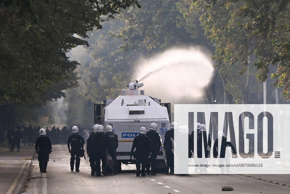 Mass Anti-Government National Protest in Tirana TIRANA, ALBANIA - OCTOBER 24: Riot police officers form a dense shield wall next to an active water cannon vehicle operating on a debris-strewn street on October 24, 2026, in Tirana, Albania. Unrest and physical confrontations erupt in Tirana city center as demonstrators and riot police clash during a massive nationwide protest, turning the capital s main avenue into a major flashpoint as chaotic skirmishes broke out between security forces and factions of the crowd. Artur Widak Anadolu Tirana Albania. Editorial use only. Please get in touch for any other usage.
