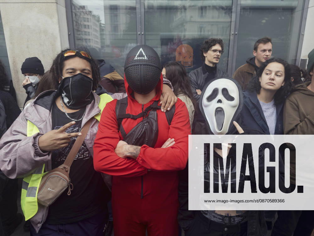 Lyon France Anti-Government Protest Three demonstrators wearing face coverings, including a white Scream-style mask, stand together during a protest in Lyon, France, on October 24, 2026. The demonstration took place amid renewed protests over living costs, wages and public services, while authorities restricted gatherings in parts of central Lyon following unrest during demonstrations the previous weekend. Lyon Rhone Alpes France
