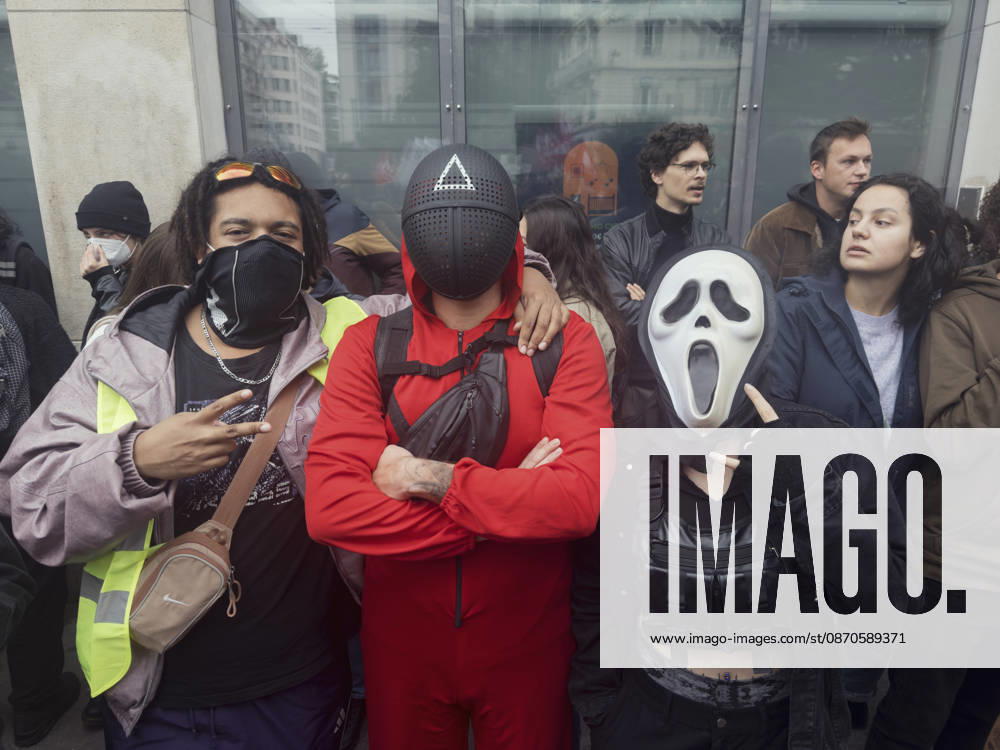 Lyon France Anti-Government Protest Three demonstrators wearing face coverings, including a white Scream-style mask, stand together during a protest in Lyon, France, on October 24, 2026. The demonstration took place amid renewed protests over living costs, wages and public services, while authorities restricted gatherings in parts of central Lyon following unrest during demonstrations the previous weekend. Lyon Rhone Alpes France