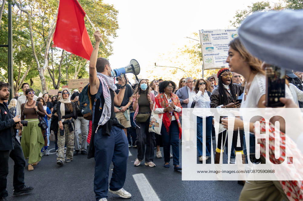 Demonstrators take part in a protest organized by the Acampada de Lisboa housing movement, demanding affordable housing, limits on rising rents and an end to property speculation. The march takes place in central Lisbon, from Marques de Pombal to Rossio Square, following recent police removal of protest tents and the detention of 55 demonstrators during housing protests in the Portuguese capital. Lisbon Portugal - ZUMAr238 20261024_zip_r238_074